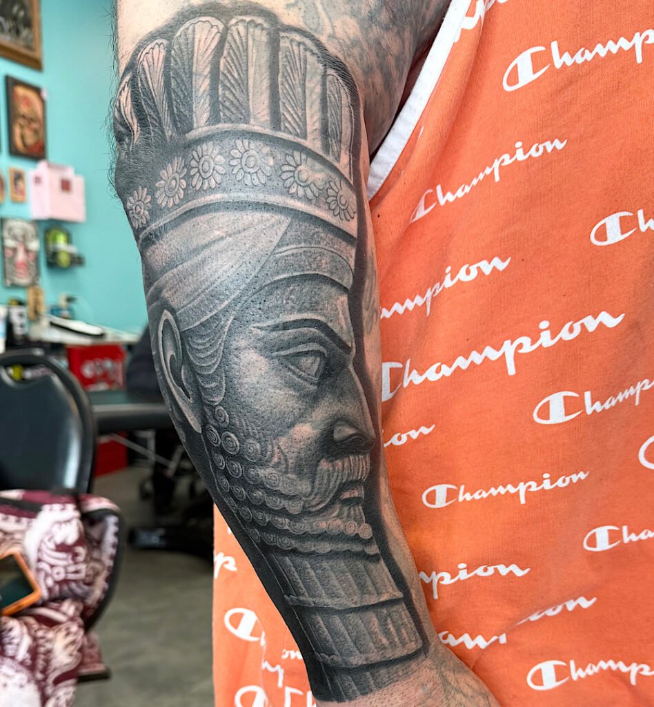 alt="Black & grey realism cover-up tattoo by Omar Barron, luxury custom tattoo Idaho"