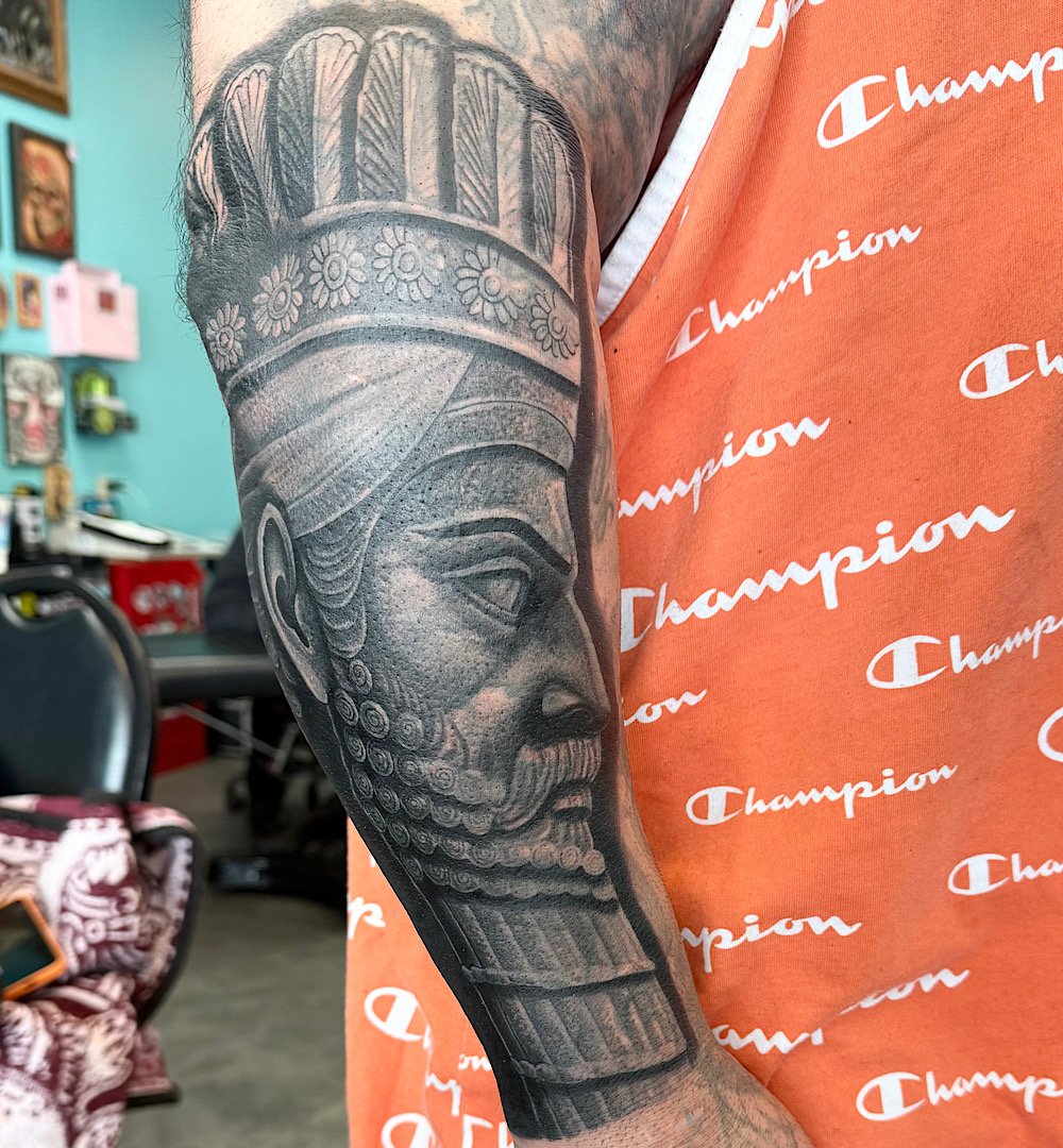 After black and grey realism cover-up tattoo by Omar Barron