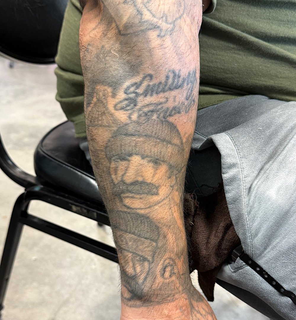 Before photo of tattoo cover-up project by Omar Barron