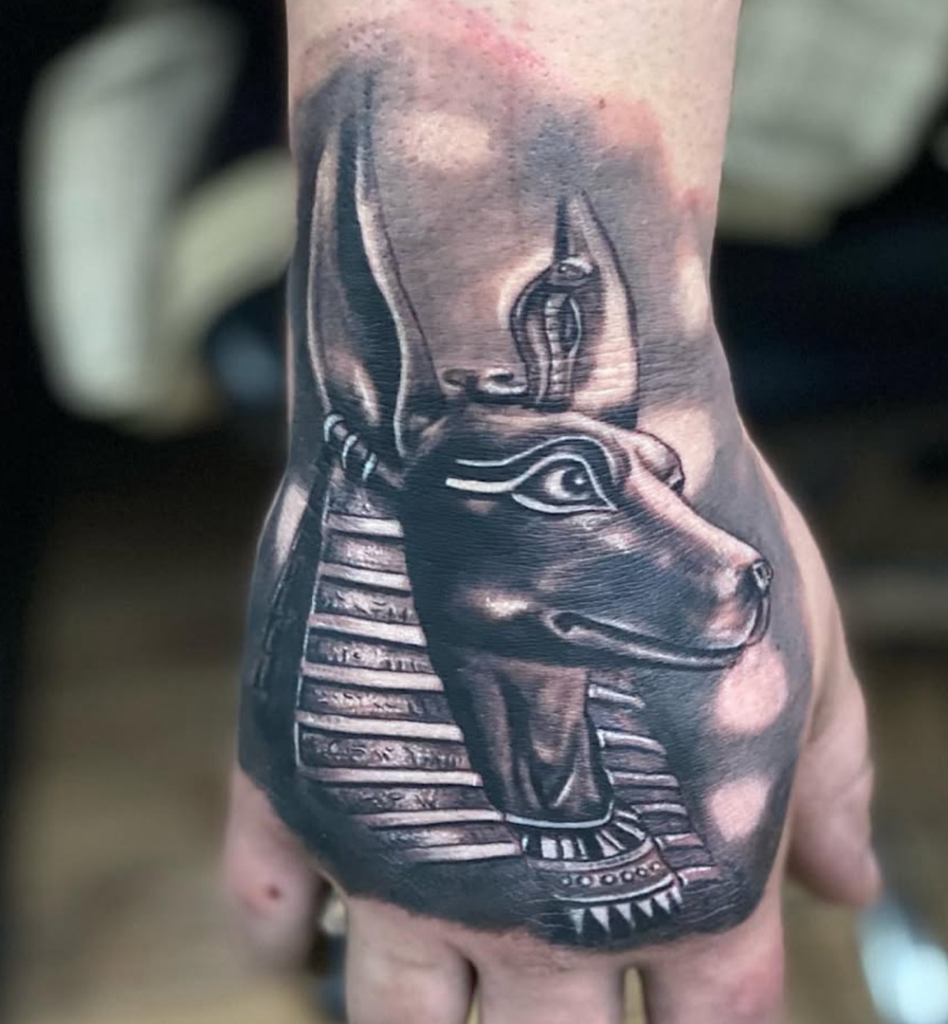 alt="Black & grey realism sleeve tattoo by Omar Barron, luxury custom tattoo Idaho"