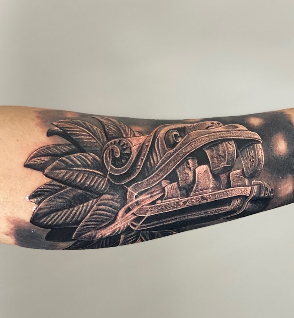 alt="Black & grey realism sleeve tattoo by Omar Barron, luxury custom tattoo Idaho"