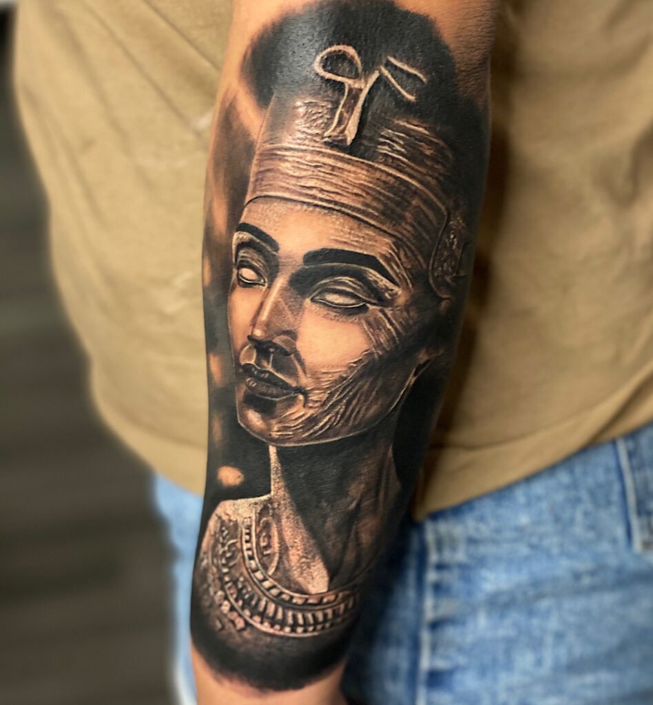 alt="Black & grey realism sleeve tattoo by Omar Barron, luxury custom tattoo Idaho"
