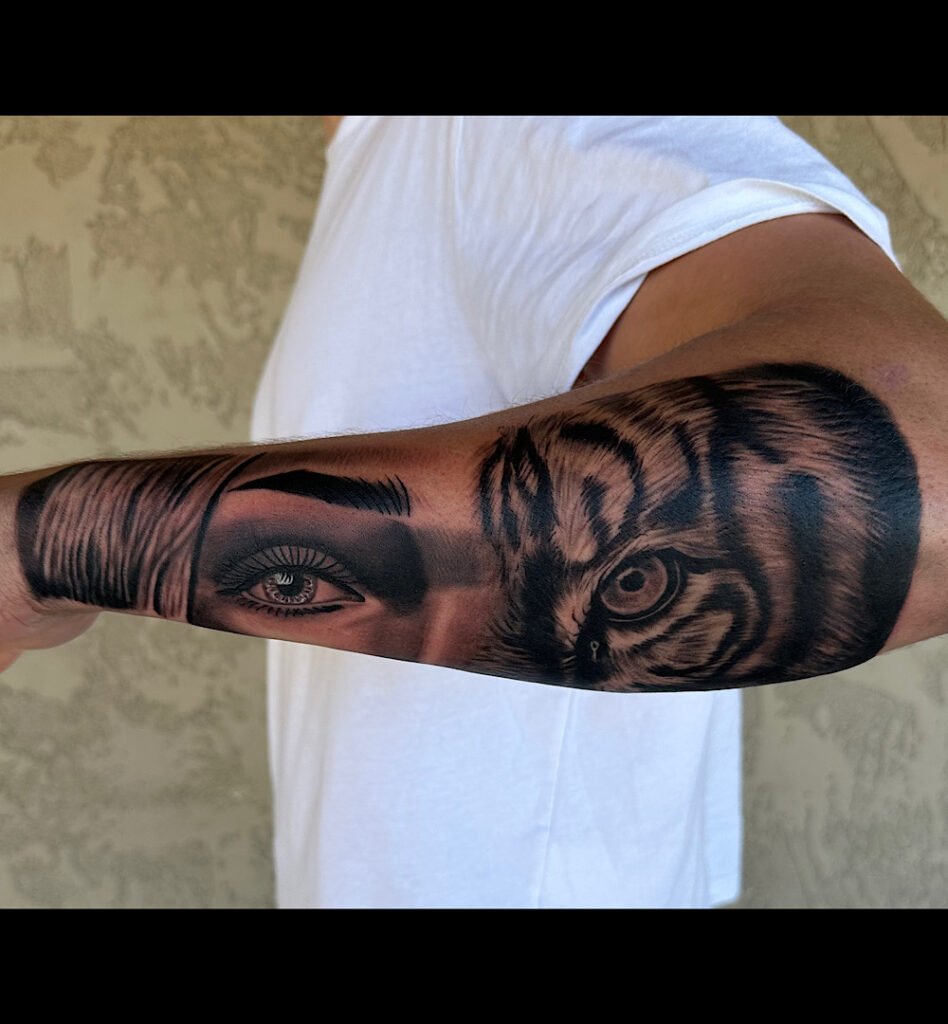alt="Black & grey realism sleeve tattoo by Omar Barron, luxury custom tattoo Idaho"