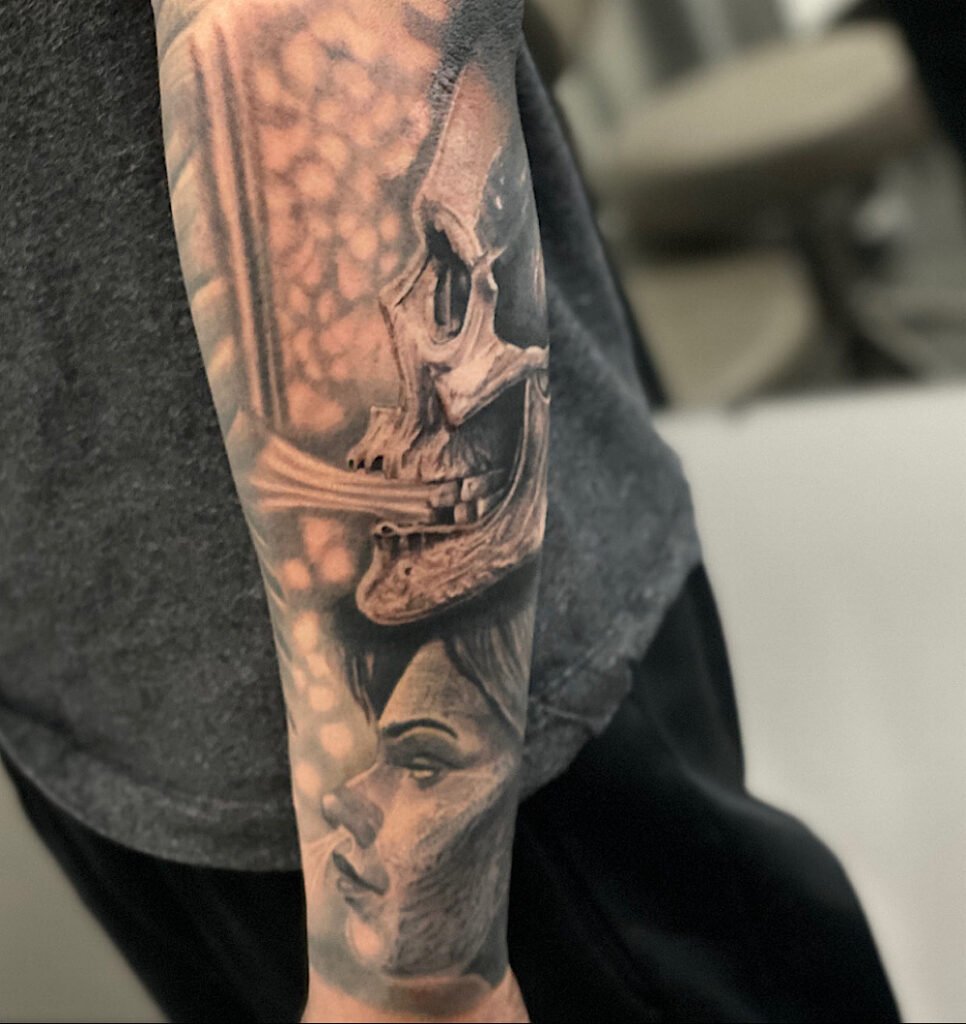 alt="Black & grey realism sleeve tattoo by Omar Barron, luxury custom tattoo Idaho"