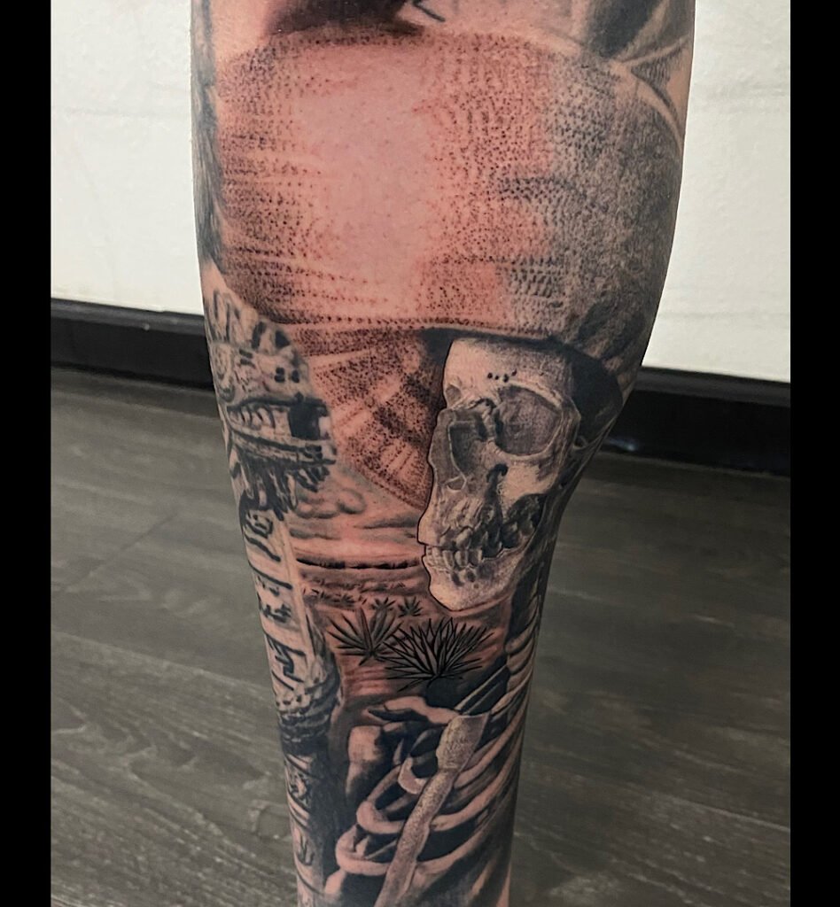 alt="Black & grey realism sleeve tattoo by Omar Barron, luxury custom tattoo Idaho"