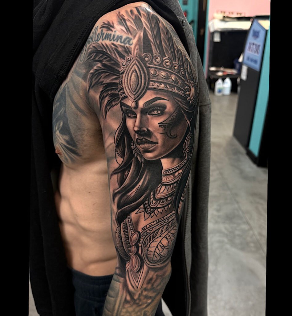 alt="Black & grey realism sleeve tattoo by Omar Barron, luxury custom tattoo Idaho"