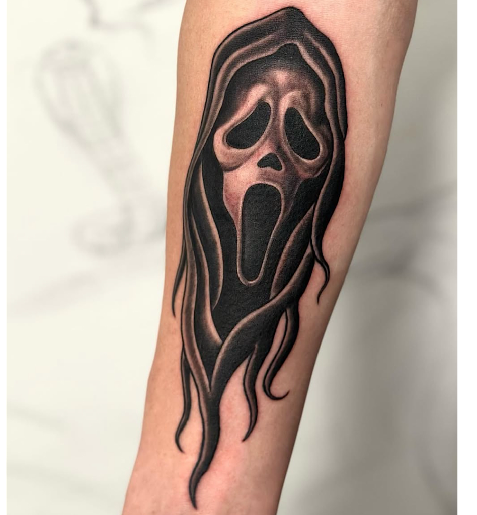 alt="Black & grey realism sleeve tattoo by Omar Barron, luxury custom tattoo Idaho"