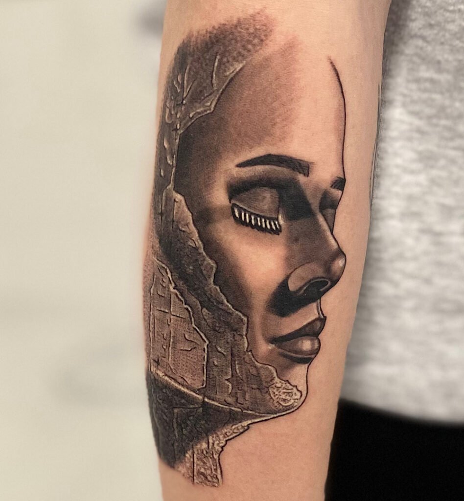 alt="Black & grey realism sleeve tattoo by Omar Barron, luxury custom tattoo Idaho"